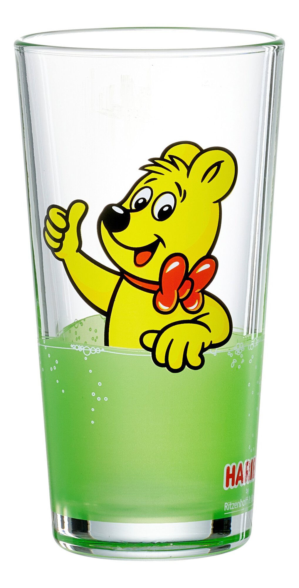 Klares Glas mit grünem Getränk und lachendem gelben Haribo B